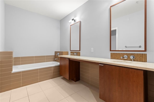 full bathroom with double vanity, backsplash, a sink, tile patterned flooring, and a bath