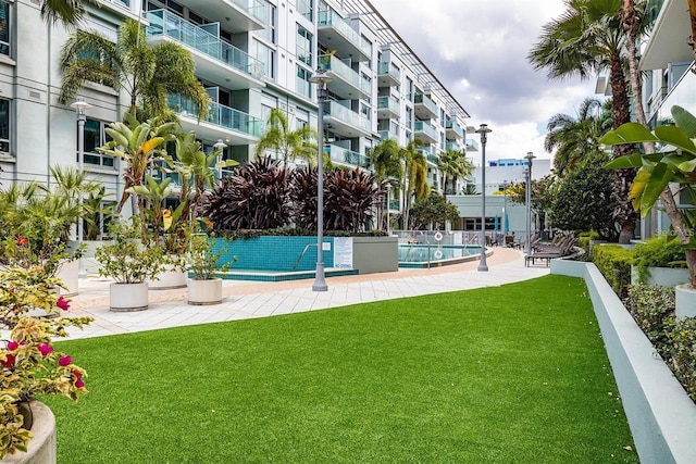 view of pool featuring a yard