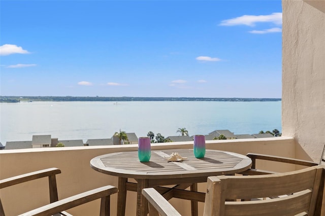 balcony featuring a water view