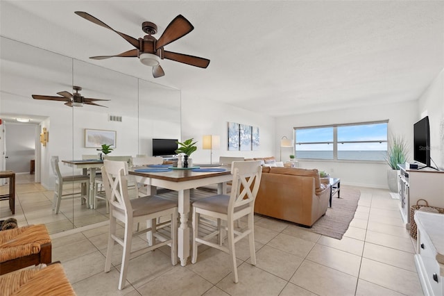 dining room with visible vents, baseboards, and light tile patterned floors