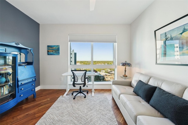 home office featuring baseboards and wood finished floors