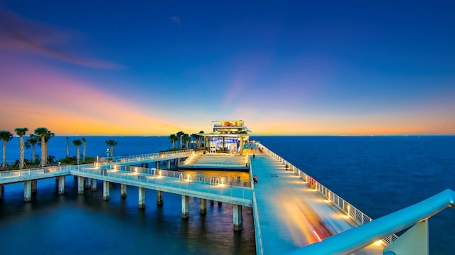 view of dock with a pier and a water view