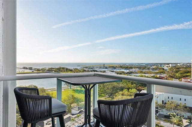 balcony featuring a water view