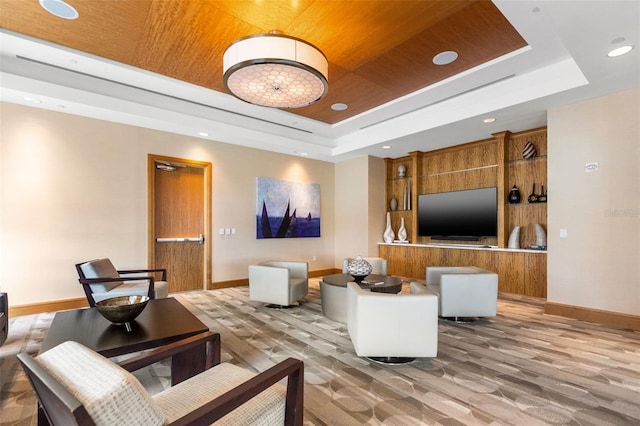 living room with baseboards, recessed lighting, a raised ceiling, wood ceiling, and light colored carpet