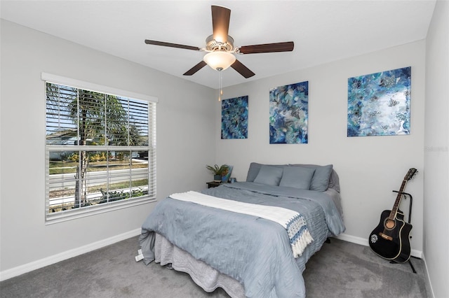 bedroom with carpet floors, ceiling fan, and baseboards