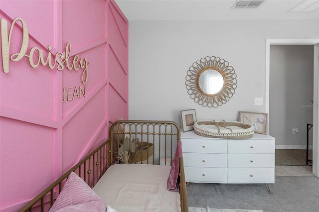 bedroom with visible vents and baseboards