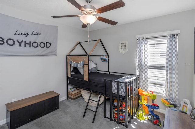 home office featuring carpet, baseboards, and ceiling fan