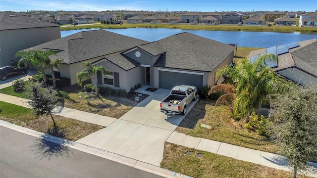 bird's eye view with a water view and a residential view