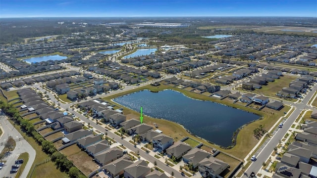 aerial view featuring a residential view and a water view