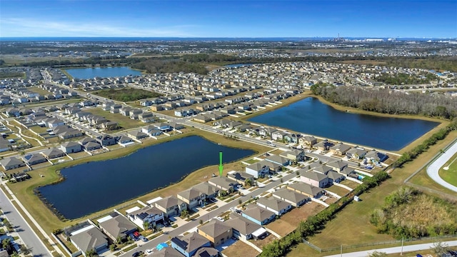 bird's eye view featuring a water view and a residential view