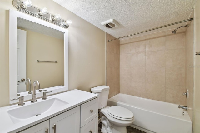 full bathroom with a textured ceiling, washtub / shower combination, vanity, and toilet