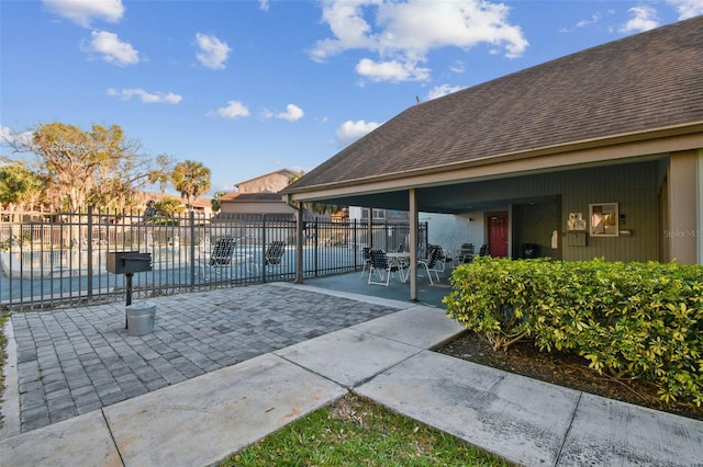 view of patio featuring fence