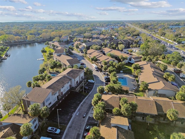 bird's eye view featuring a residential view and a water view