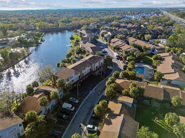 drone / aerial view with a water view and a residential view