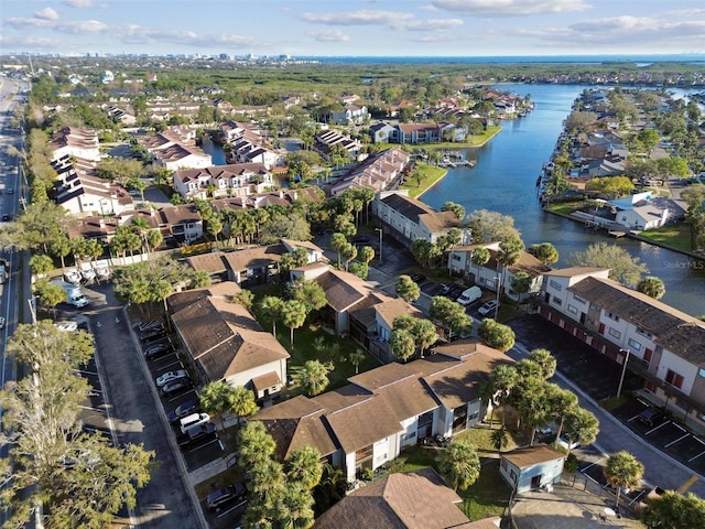 aerial view with a water view and a residential view
