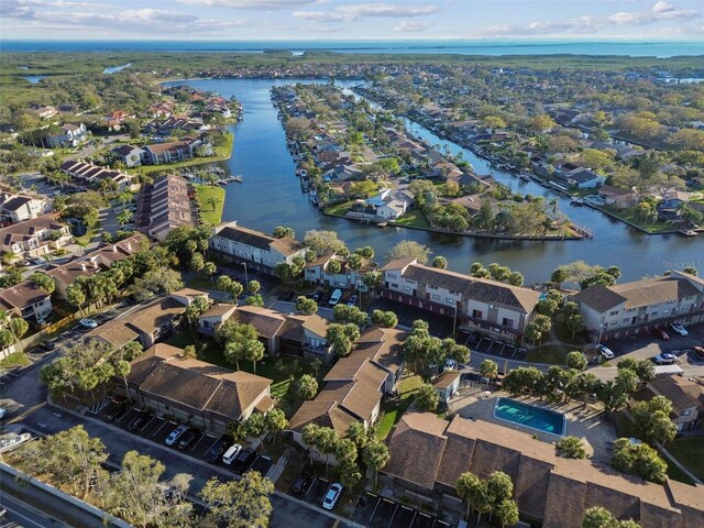 birds eye view of property featuring a water view and a residential view