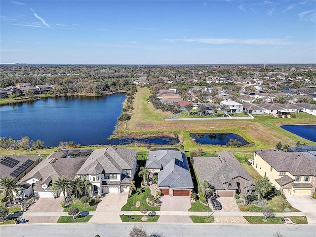 aerial view featuring a water view and a residential view