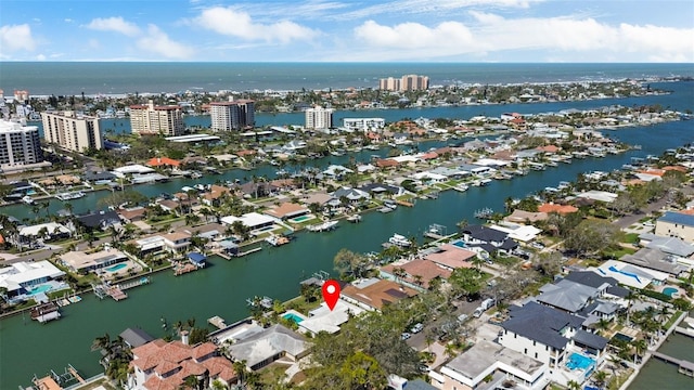 birds eye view of property with a water view