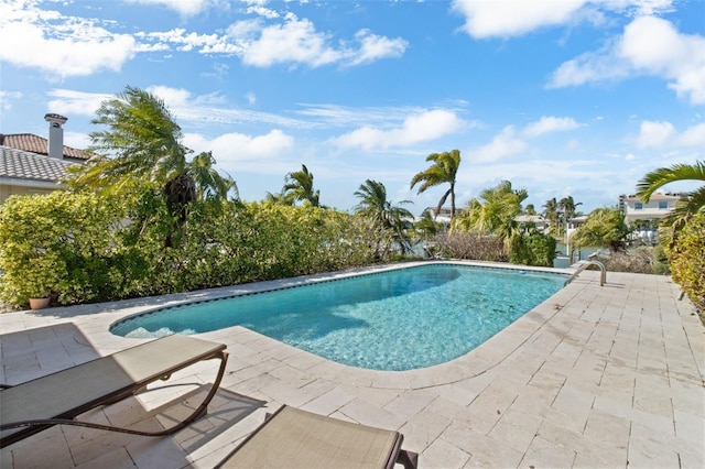 pool featuring a patio area