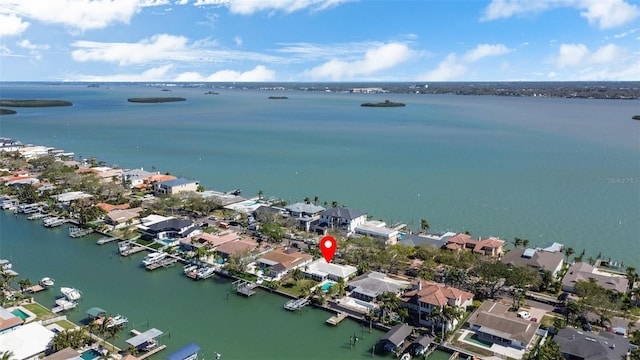 birds eye view of property with a residential view and a water view