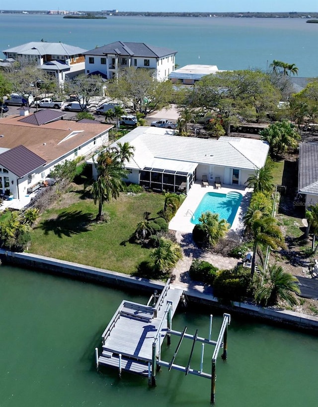 bird's eye view with a water view and a residential view