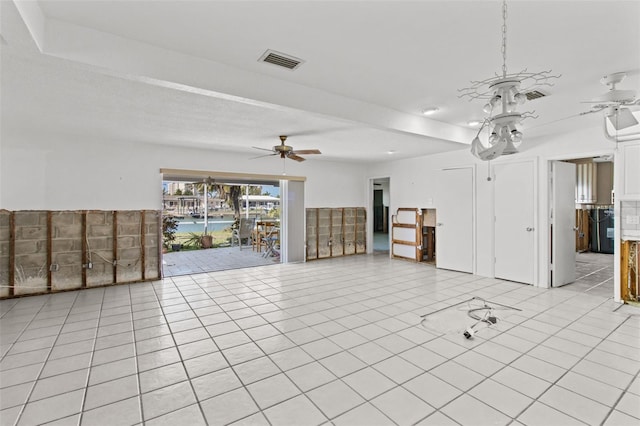 unfurnished living room featuring ceiling fan, light tile patterned flooring, and visible vents