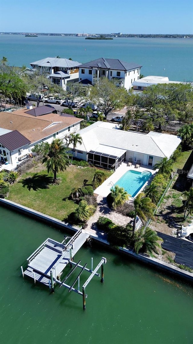 birds eye view of property featuring a water view and a residential view