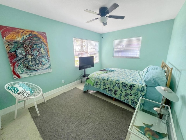 bedroom featuring ceiling fan and baseboards