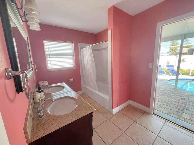 full bathroom with plenty of natural light, a sink, and shower / tub combo