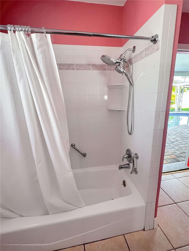 full bathroom with tile patterned flooring and shower / bath combo with shower curtain