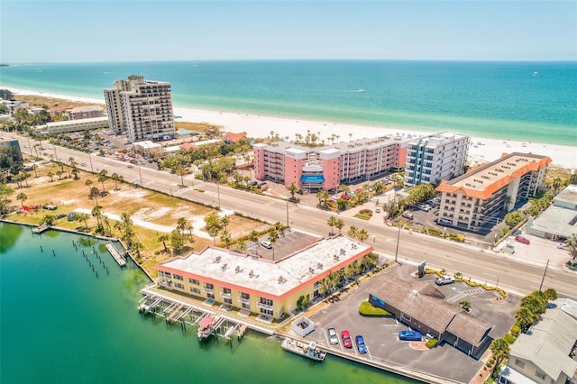 bird's eye view featuring a water view and a beach view