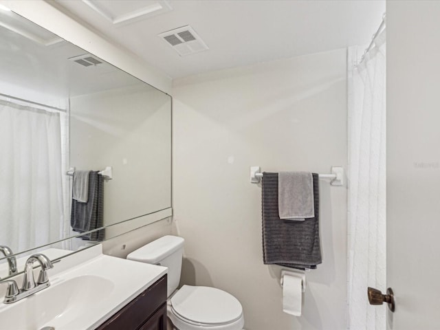 full bath featuring visible vents, vanity, and toilet