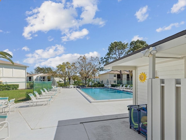 pool featuring a patio area and fence