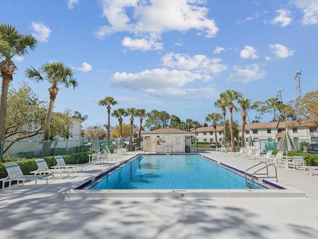 pool featuring a patio area and fence