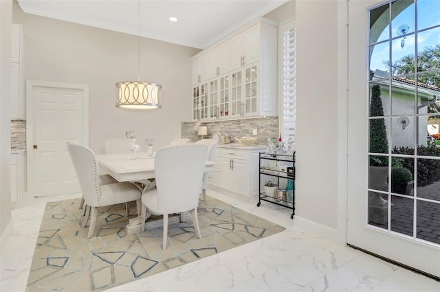 dining room featuring marble finish floor and recessed lighting