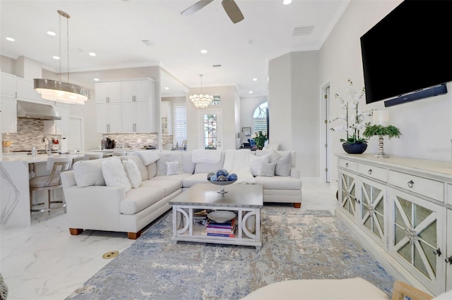 living area with marble finish floor, visible vents, ornamental molding, and recessed lighting