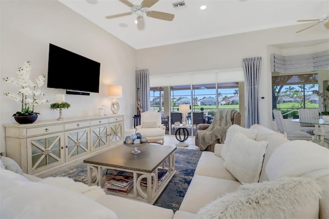 living room featuring visible vents and a ceiling fan