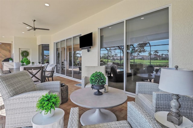 view of patio featuring ceiling fan and outdoor dining space