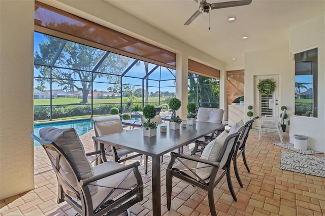 sunroom / solarium with ceiling fan