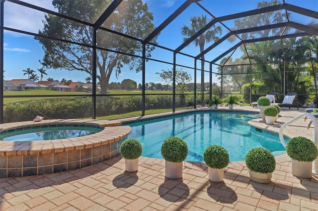 outdoor pool with a lanai, a patio area, and an in ground hot tub