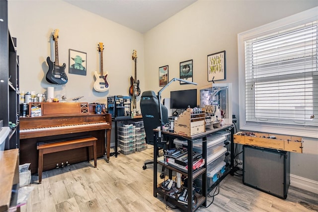 office area with wood finished floors and baseboards