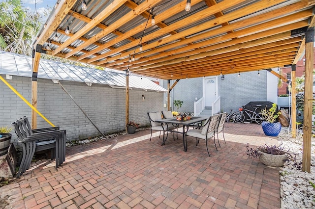 view of patio / terrace featuring entry steps and outdoor dining area