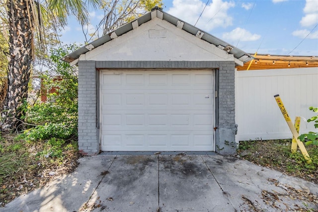 detached garage featuring driveway