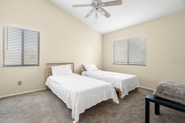 carpeted bedroom featuring ceiling fan, baseboards, and vaulted ceiling