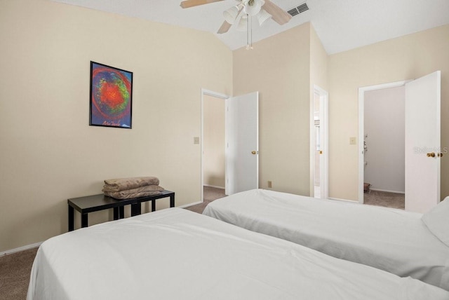 carpeted bedroom featuring lofted ceiling, a ceiling fan, visible vents, and baseboards