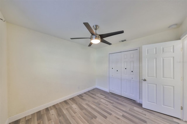 unfurnished bedroom with visible vents, baseboards, a ceiling fan, light wood-type flooring, and a closet