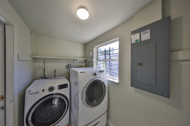 washroom with laundry area, electric panel, and independent washer and dryer