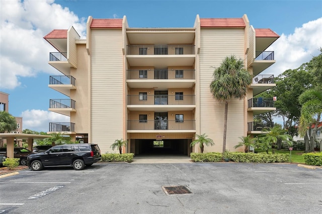 view of property featuring uncovered parking