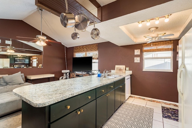 kitchen with white appliances, light countertops, a peninsula, and a textured ceiling