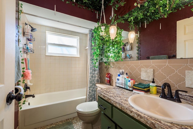 full bath with toilet, vanity, tile walls, backsplash, and shower / bath combo